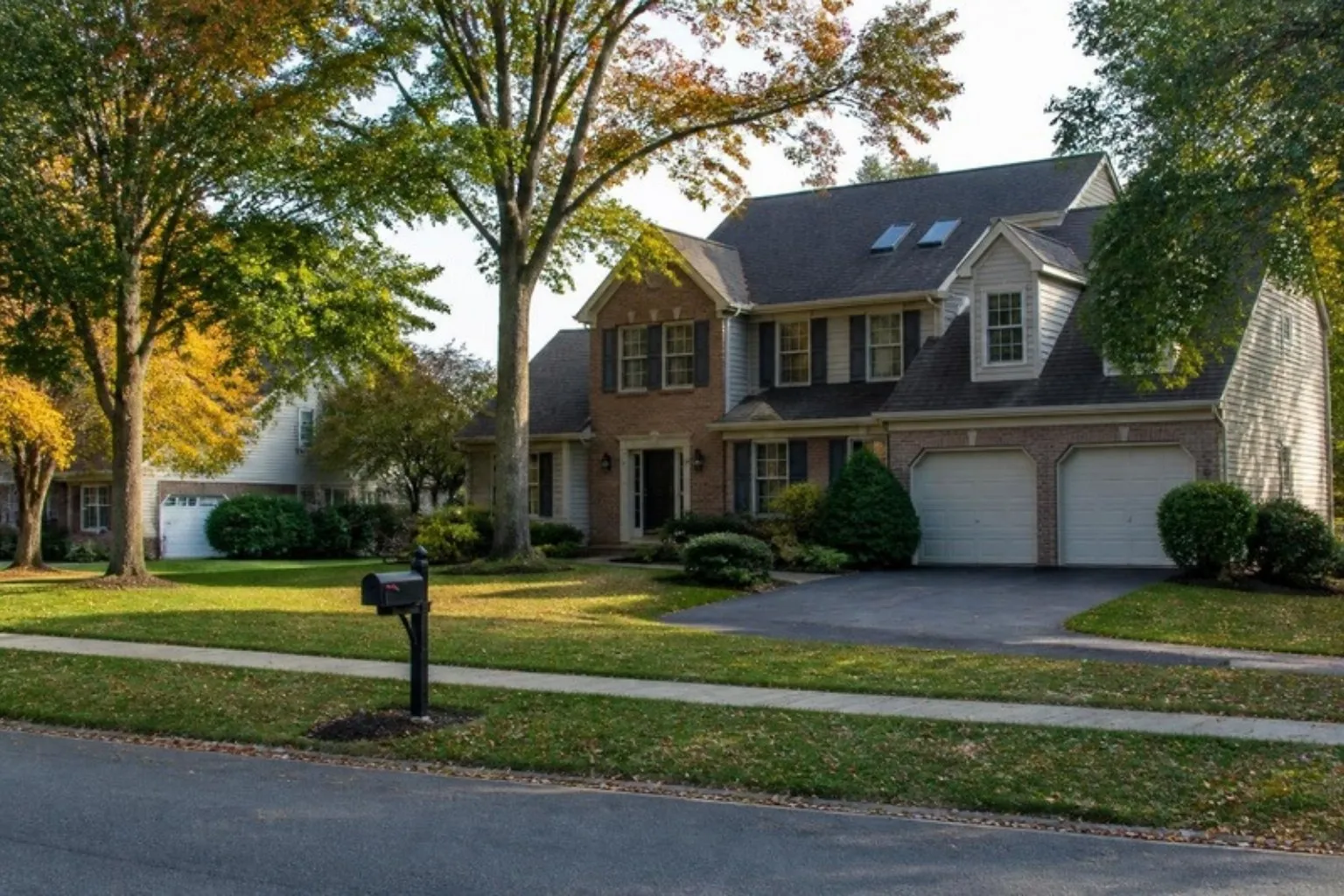 Two-story colonial homes on a quiet suburban street